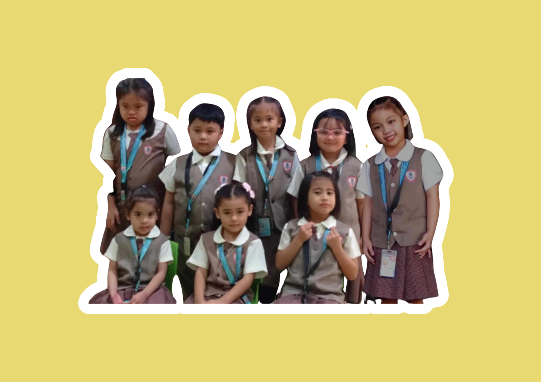 Group of school children in uniform against yellow background